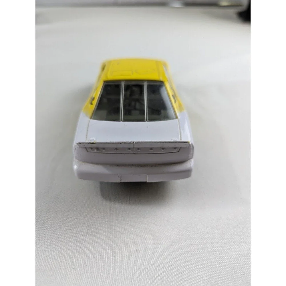 1996 Racing Champions Chevrolet BriCkyard 400 1:64 Monte Carlo Car Yellow